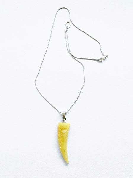 . NESHKA artwork 'MILKY AMBER SHARK TOOTH PENDANT' at Canada House Gallery