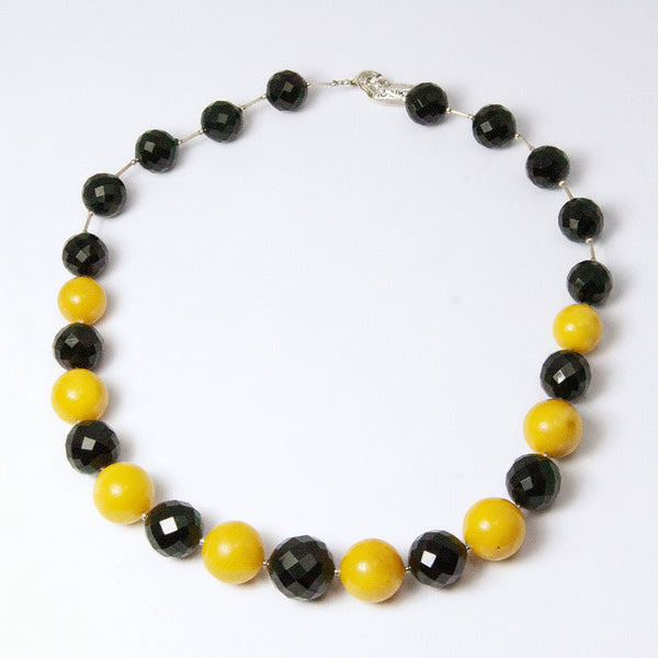 NESHKA artwork 'FACETED CHERRY & ANTIQUE MILKY AMBER NECKLACE' available at Canada House Gallery - Banff, Alberta