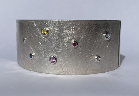 STERLING SILVER CUFF WITH VARIOUS GEMS