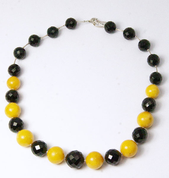 NESHKA artwork 'FACETED CHERRY & ANTIQUE MILKY AMBER NECKLACE' available at Canada House Gallery - Banff, Alberta